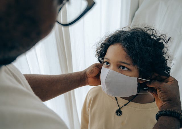 child wearing surgical mask