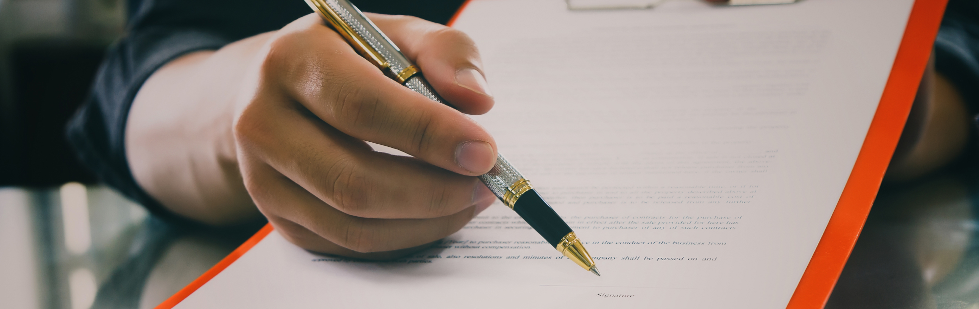 Close up of business man signing contract making a deal business contract details